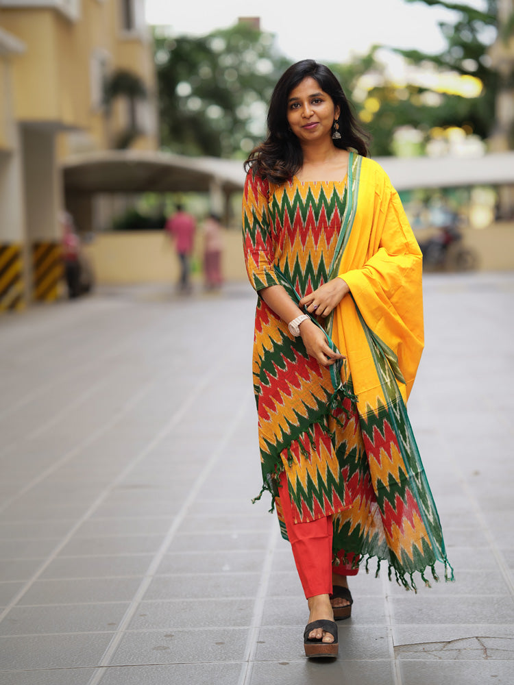 Ikkath suit is vibrant colors and geometric or traditional designs.