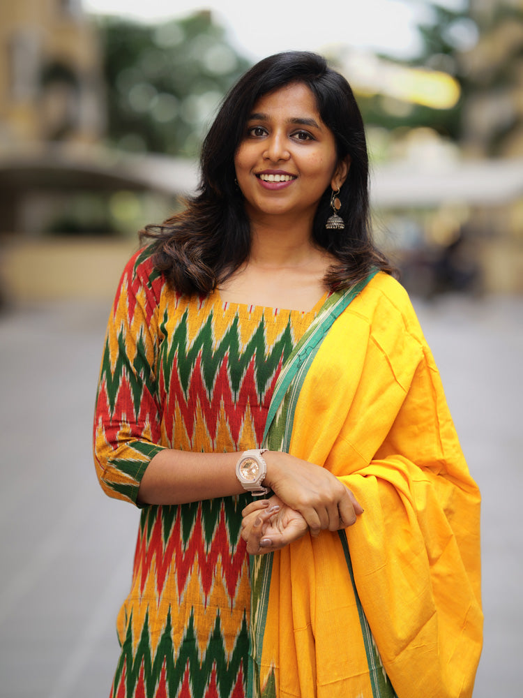 Ikkath suit is vibrant colors and geometric or traditional designs.